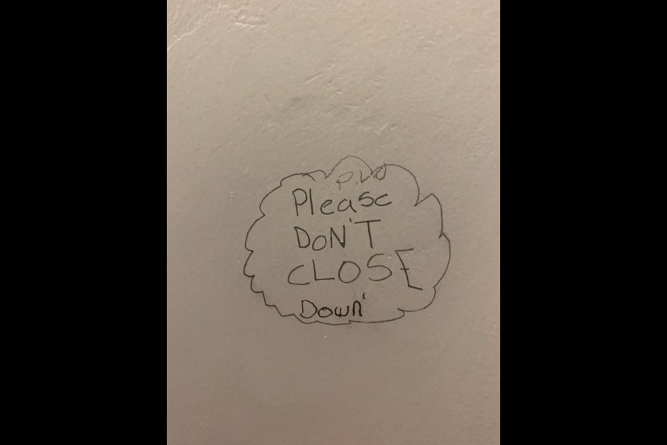 Graffiti found by staff in a washroom at Exshaw School. SUBMITTED PHOTO. 