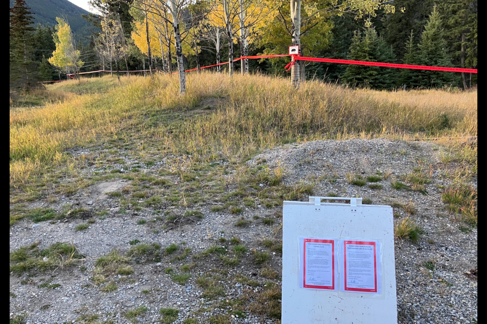 Signs and tape are set up behind the Fenlands recreation centre where bear 122 had been feeding on an animal carcass. CONTRIBUTED PHOTO