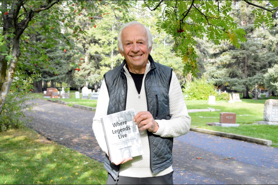Banff author and historian, Graham MacDonald, holds up his latest book Where Legends Live: a historical walk through the Old Banff Cemetery unlocking the stories of the past. JORDAN SMALL RMO PHOTO