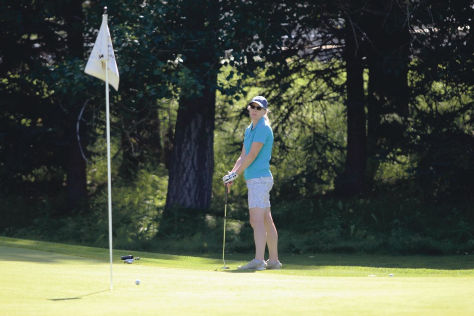 Canmore's Kelly Smith watches her ball head for the hole during Alberta Golf's Ladies Team Classic Championship at the Canmore Golf and Curling Club course on Tuesday (Aug. 20). Jordan Small RMO PHOTO