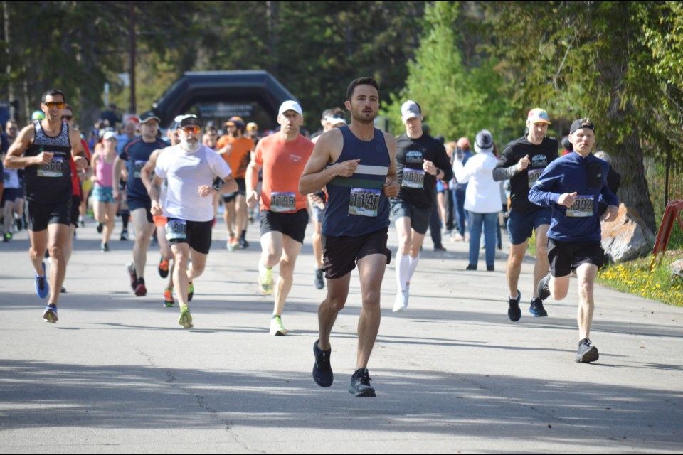 From start to finish, Banff's Jesse Kitteridge (1147) dashes out to the front of the pack of the Banff half marathon on Sunday (June 19) and doesn't look back. The local runner finished first overall at a time of 1:19:53. JORDAN SMALL RMO PHOTO