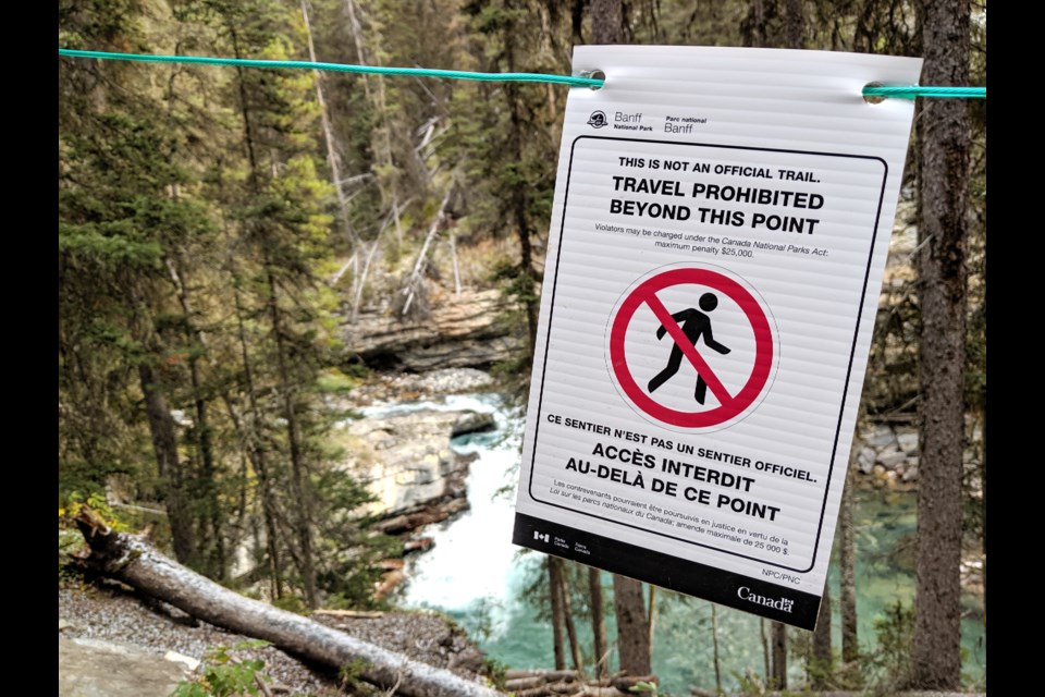 One of the 32 signs posted along the Johnston Canyon trail warning hikers not to go off the trail. 
JENNA DULEWICH RMO PHOTO