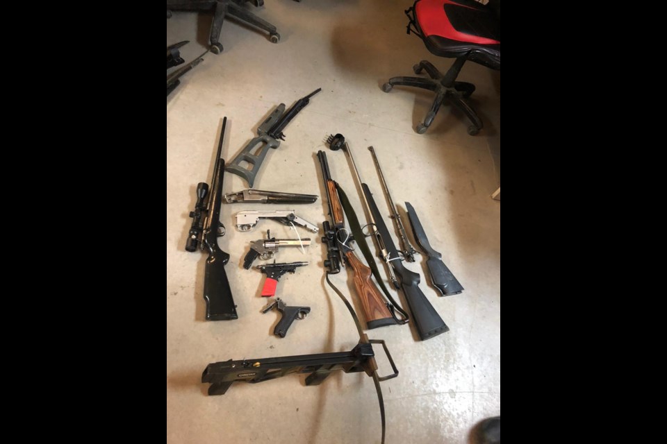 Weapons confiscated by Cochrane RCMP at a residence in Stoney Nakoda on May 7. COCHRANE RCMP PHOTO