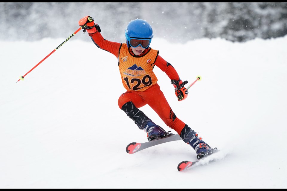 Jack Henning of Bow Valley Quikies rides the Tincan Alley slope at the 40th anniversary of the Nancy Greene Sunshine Invitational at Sunshine Village in Banff on Saturday (Feb. 3). MALCOLM CARMICHAEL - CARMICHAELPHOTO.COM                               