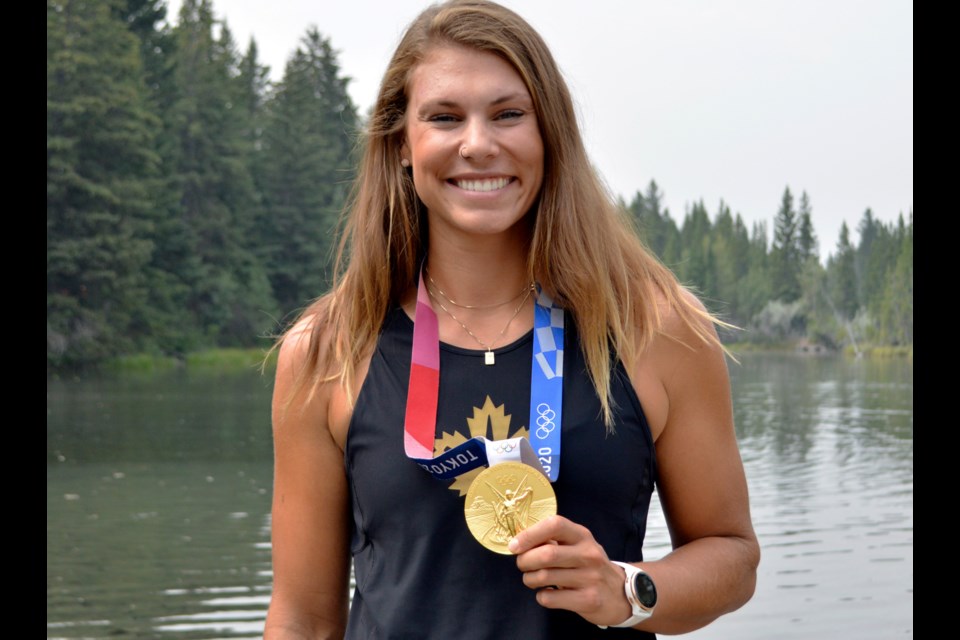 Canadian Kasia Gruchalla-Wesierski shows off her sparkling gold medal in Canmore on Sunday (Aug. 1). The Olympic rower helped push her women's eight team to victory in Tokyo on Friday (July 29). JORDAN SMALL RMO PHOTO