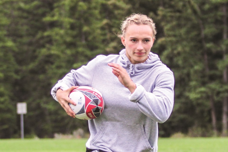 Local rugby player Krissy Scurfield sprints at Millennium Field in Canmore in June 2021. JORDAN SMALL RMO PHOTO