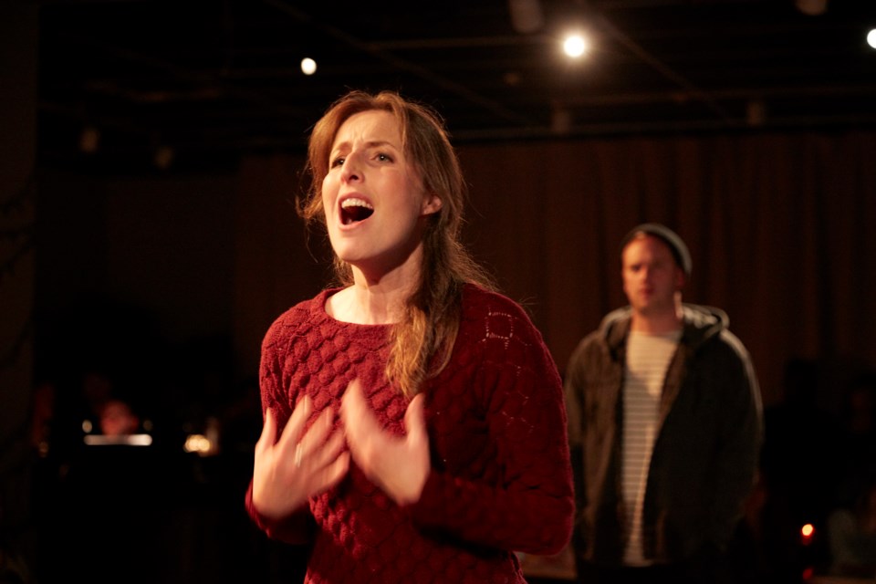 Mimi, played by Kimy McLaren, sings her heart out while Marcello, played by Andrew Love, gazes at her from a distance. DARRYL BLOCK SUBMITTED PHOTO