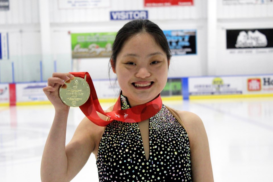 Figure skater Meg Ohsada holds up her gold medal from the 2020 Special Olympics Canada Winter Games. JORDAN SMALL RMO PHOTO