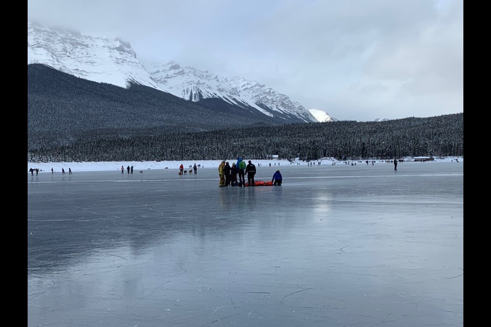 Paramedics respond to an injured skater on Lake Minnewanka Tuesday (Dec. 31). ELIZABETH HALL-FINDLAY PHOTO