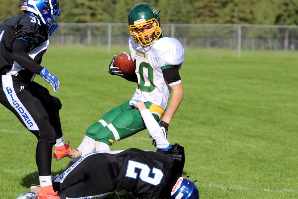Wolverines wide receiver, Lake Sanford, catches the ball before hitting the ground at Canmore's Millennium Field on Thursday (Aug. 29). The Wolverines lost 38-2 in the season opener. Jordan Small RMO Photo