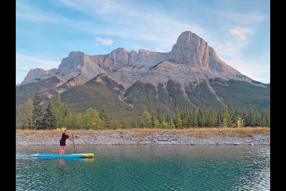 With Ha Ling in the background, Kirstin Zabos paddleboards in Canmore. SUBMITTED PHOTO