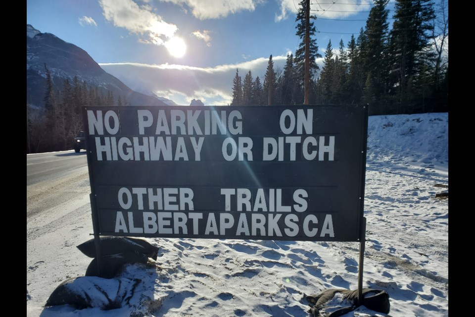 A temporary sign near the Grotto recreation area in the MD of Bighorn informs motorists that parking along the shoulder of the 1A Highway is prohibited. CANMORE RCMP PHOTO