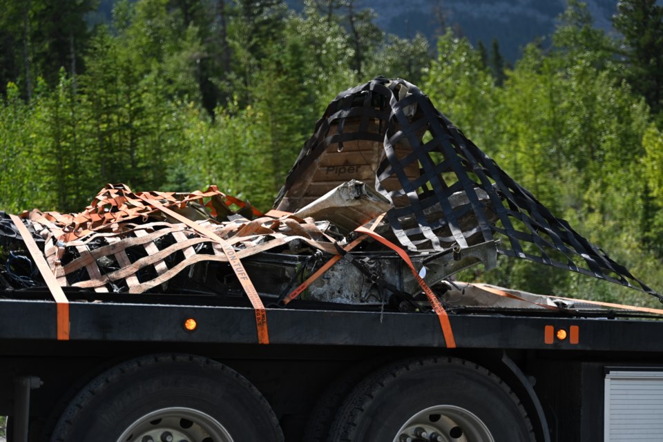 Mangled pieces of the plane that crashed in Kananaskis Country were airlifted out from the wreckage area and relocated on a flatbed truck on Saturday (July 29). MATTHEW THOMPSON RMO PHOTO
