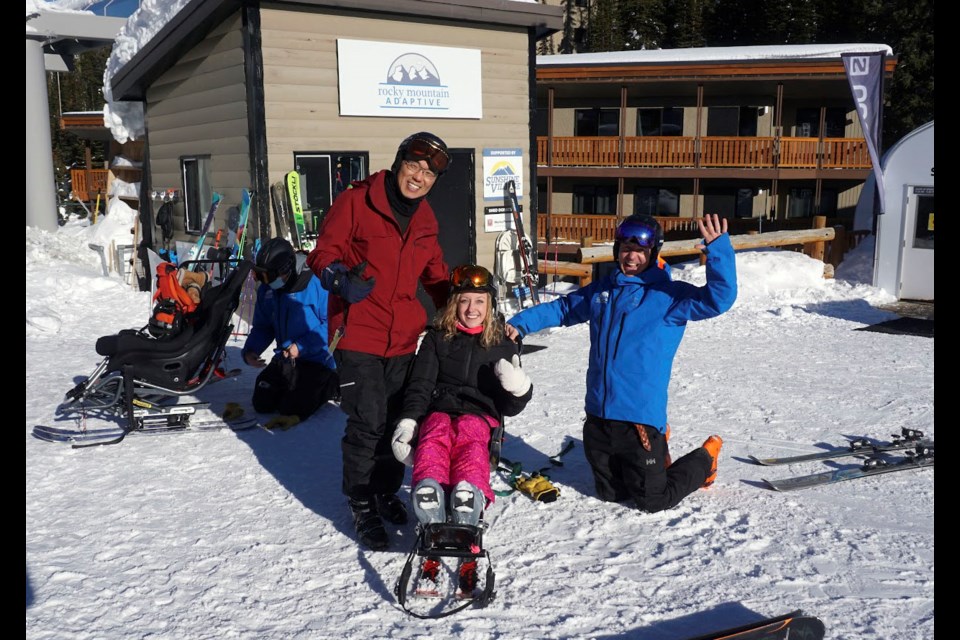 Jason Luan, then Minister of Community and Social Services, left, and MLA Banff-Kananaskis Miranda Rosin, centre, try out Rocky Mountain Adaptive's adaptive skiing equipment with Jamie McCulloch, RMA executive director, earlier in 2022 at Sunshine Village. SUBMITTED PHOTO