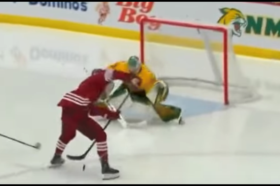 Former Canmore Eagles captain Colton Young schools Northern Michigan's goalie on Jan. 8.