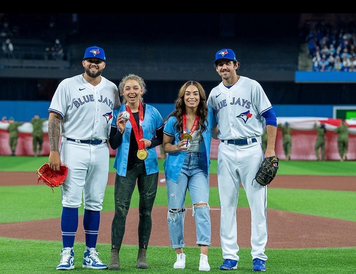 Para Nordic skier Natalie Wilkie and Olympic hockey player Sarah Nurse with Blue Jays pitchers Jordan Romano and Alek Manoah at Rogers Centre in Toronto on April 8. TORONTO BLUE JAYS INSTAGRAM