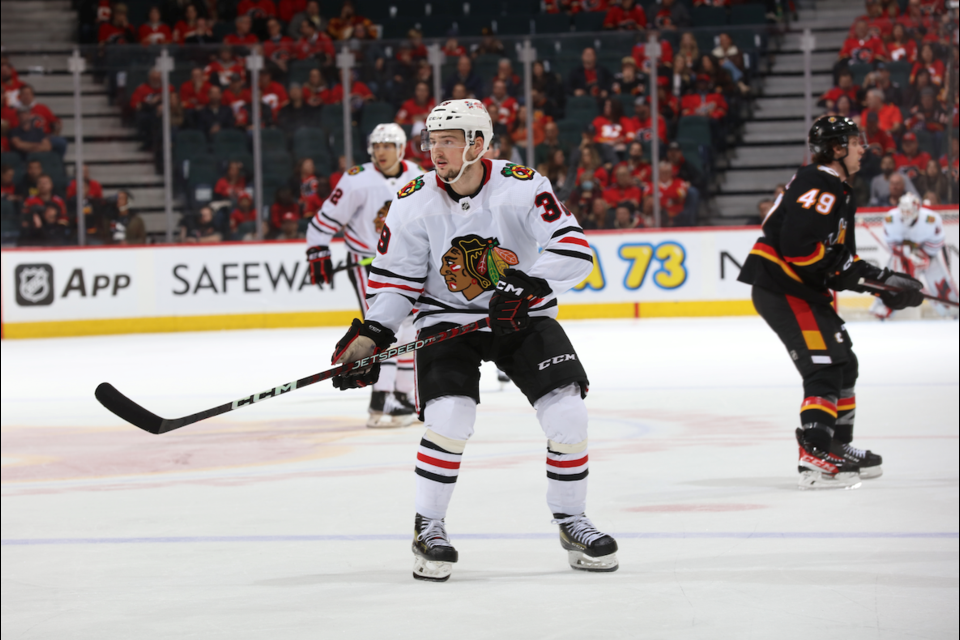 Suiting up for the Chicago Blackhawks, Luke Philp plays against the Calgary Flames on Jan. 26, 2023. GERRY THOMAS CALGARY FLAMES HOCKEY CLUB PHOTO