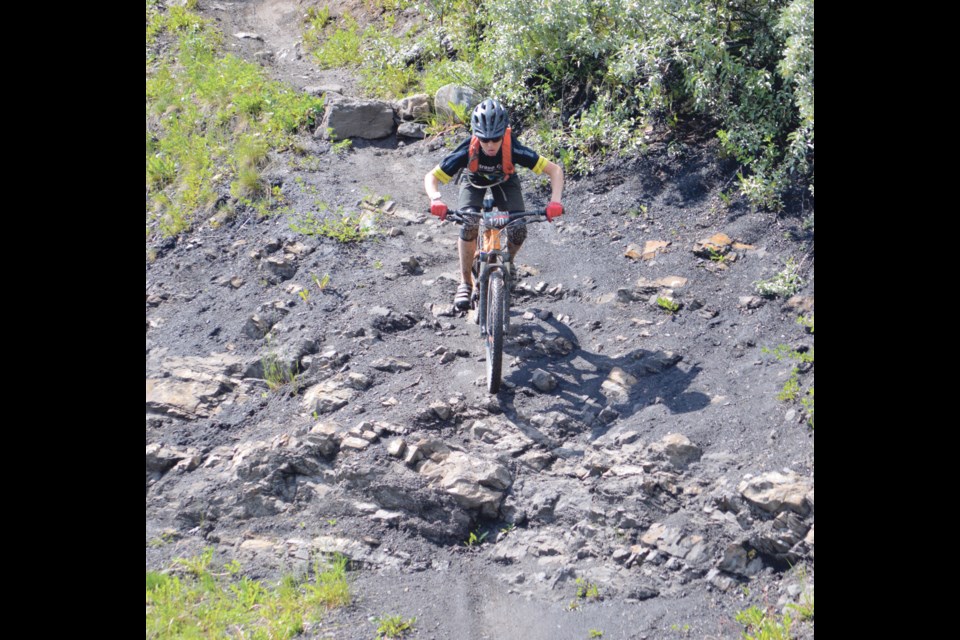 A racer rushes down the Eyedropper at the Canmore Nordic Centre during the Steedz Enduro race in 2019. RMO FILE PHOTO