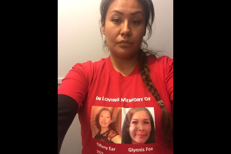 Kaila Ear, sister of slain Stoney Nakoda sisters Tiffany Ear and Glynnis Fox, who were both murdered in 2017 in Calgary, honours her siblings with a T-shirt that reads, "In Loving Memory."
SUBMITTED