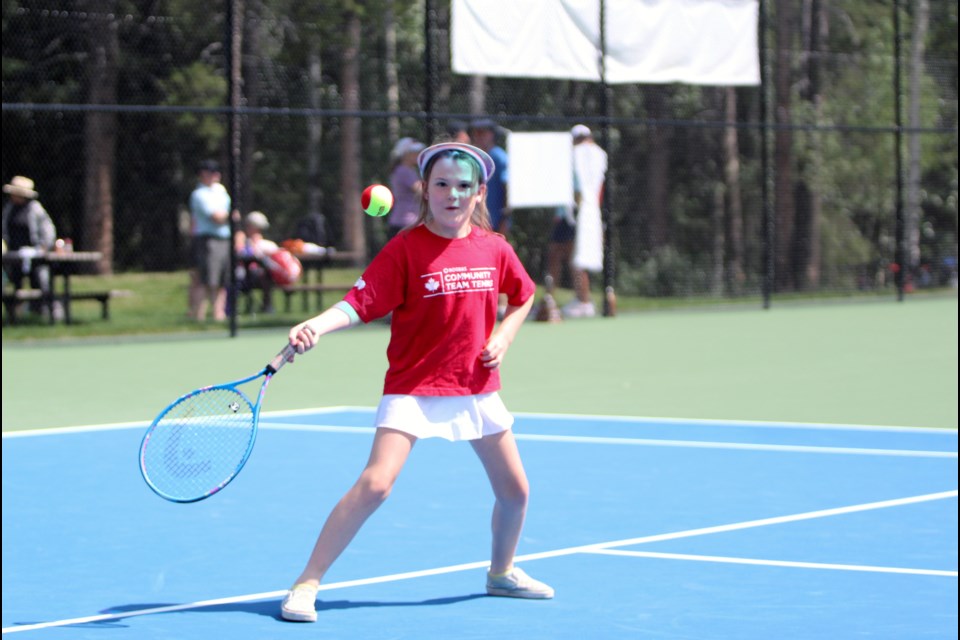 Claire Samaroden gets ready to smack a ball at Lions Park in Canmore during the Canmore Tennis Association's grand opening of the four new tennis courts on Sunday (July 30). JORDAN SMALL RMO PHOTO