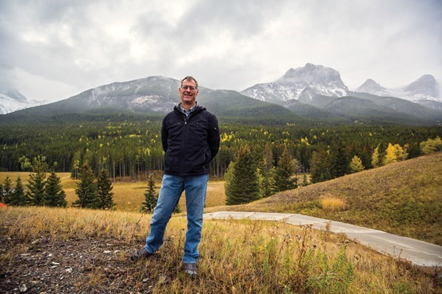 Three Sisters Mountain Village chairman David Taylor stands next to the proposed development site for a resort centre in Canmore in September. RMO File Photo