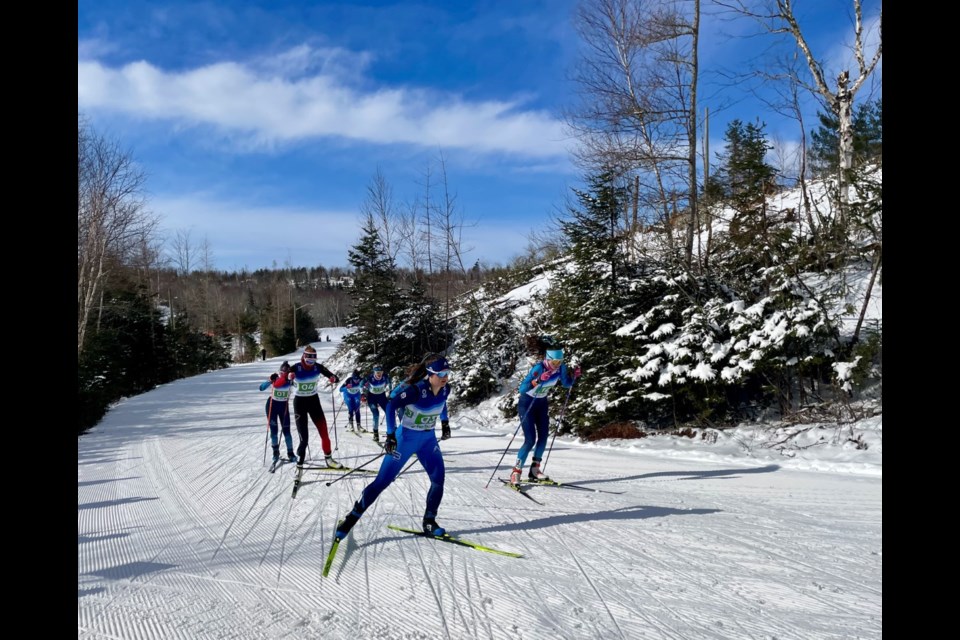 Canmore's Sabine Comeau, lead, races in the mixed relay for Team Aberta. ANDREAS COMEAU PHOTO