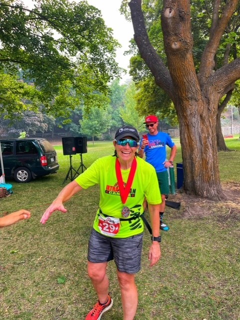 With a medal around her neck, Heather Myers is all smiles post-Ultraman Canada. JOHN BURROUGHS PHOTO