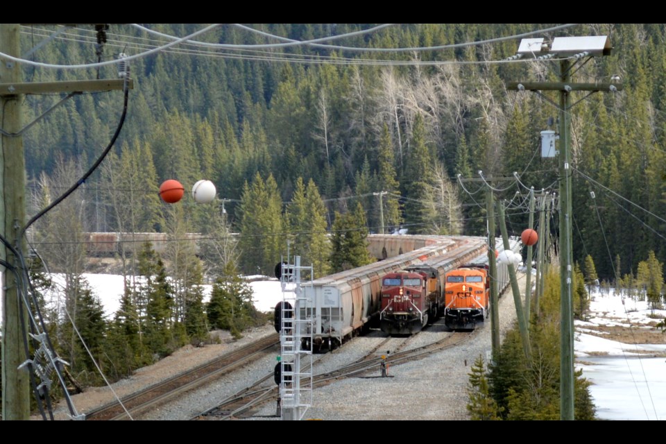 Trains in queue west of Field, B.C. on Saturday afternoon (April 30). Last night, a CP freight train derailed four cars, approximately 10 kilometres west of Field. JORDAN SMALL RMO PHOTO