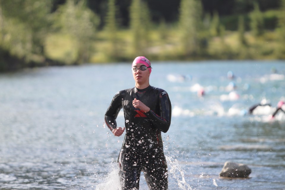 Triathletes start coming out of Quarry Lake during the XTERRA and Canmore Road triathlons on Sunday (Aug. 18) in Canmore. Jordan Small RMO PHOTO