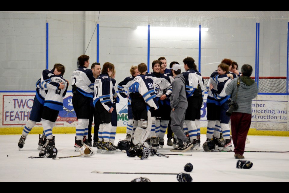 The U15 Canmore Eagles celebrate winning the Tier 1 Hockey Alberta Provincial banner. JORDAN SMALL RMO PHOTO