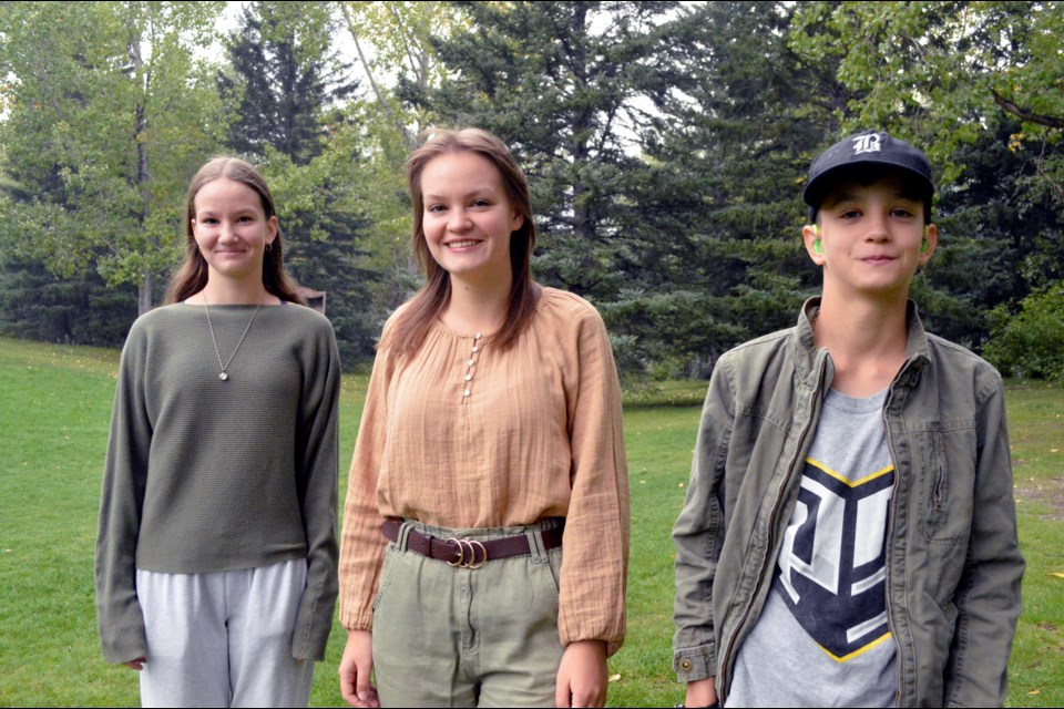 Talented siblings Vasylisa, left, and Anya, centre, who play piano, and Gregory the guitarist are ready to perform Harvest Festival this weekend in Banff. JORDAN SMALL RMO PHOTO
