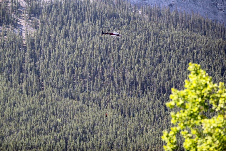 Two Kananaskis Country Public Safety specialists are heli-slung by an Alpine Helicopter pilot to East End of Rundle near Canmore on Sunday afternoon (May 28). JORDAN SMALL RMO PHOTO