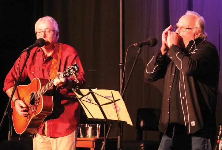 Mike Petroff, left, and Pat Sullivan perform at the Songs for Shelter fundraiser at the Canmore Miners’ Union Hall, Friday (Jan. 12).
