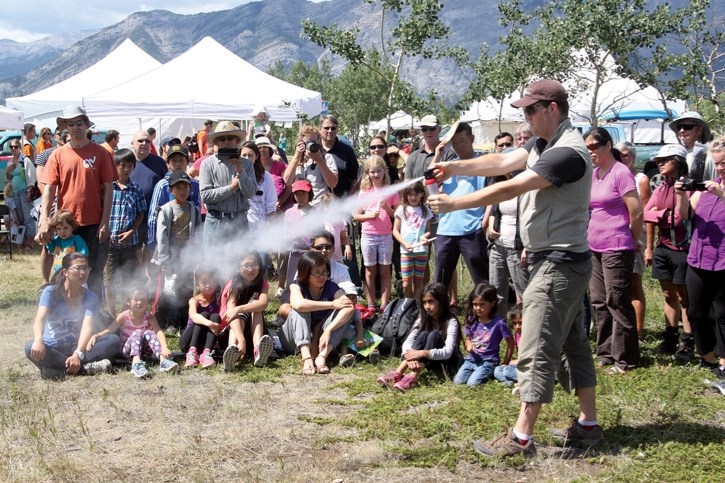 Wildsmart’s Wildlife Ambassador liaison Tyler McClaron demonstrates how to properly use bear spray. Wildsmart is currently recruiting for volunteers to fill the ambassador