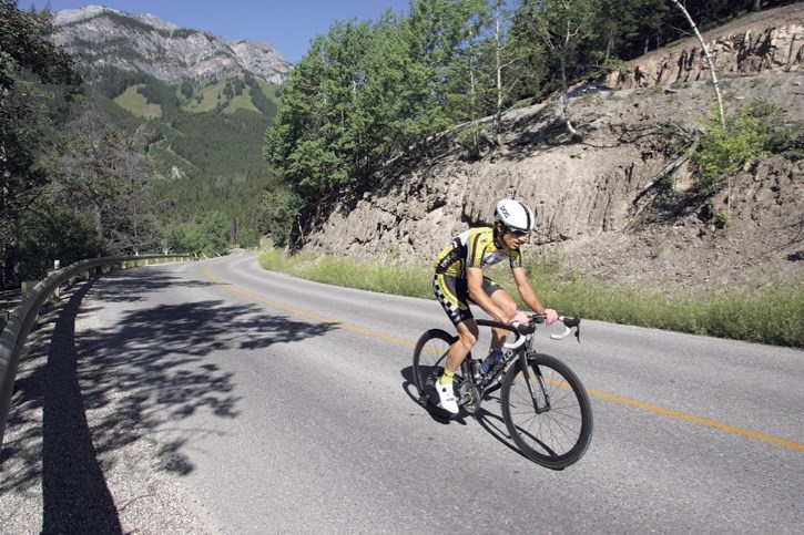 A cyclist rides up the Norquay access road in Banff National Park. An aerial gondola from Mount Norquay to the Banff townsite is no longer pie in the sky now that the