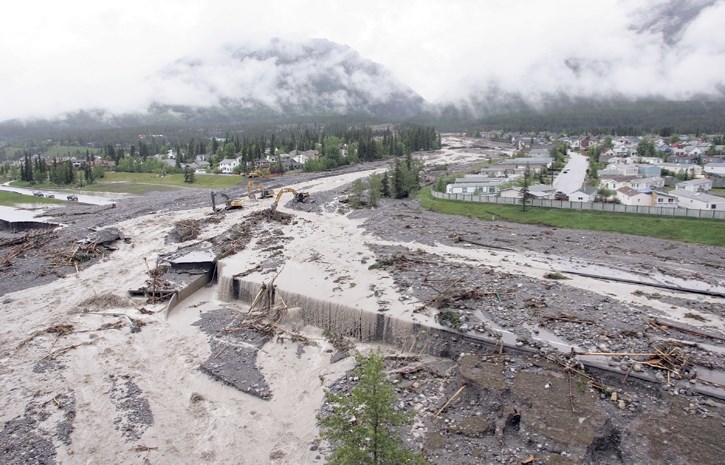 Above average rainfall combined with a late snowpack resulted in mountain creek debris flows in Cougar Creek during June 2013.