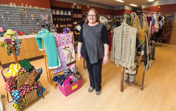 Rhonda Sauerberg, proprietor of Cornucopia Gifts, stands next to some of the Southern Albertan made products for sale at her retail store on 10th Street in Canmore on