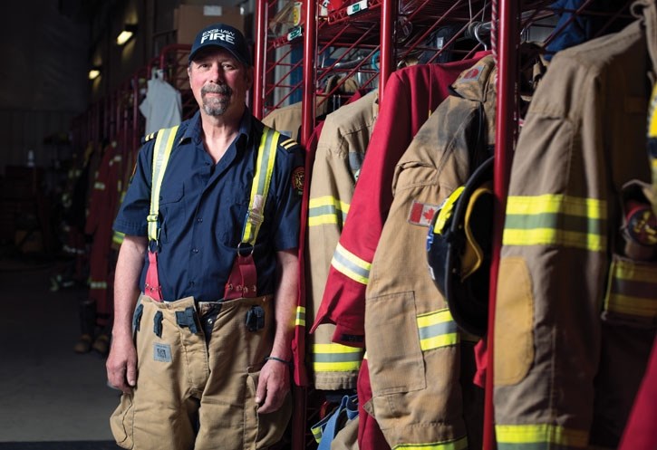 Captain Lee Leibel stands at the Exshaw Fire Department fire hall on Friday (May 11). Leibel, who is retiring after 27-years of service with the fire department, was honoured 