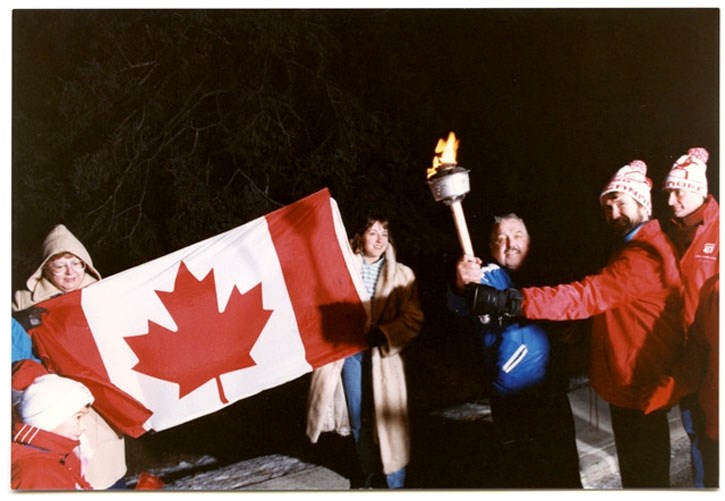The 1988 Winter Olympics torch is shown during the torch parade in Canmore.