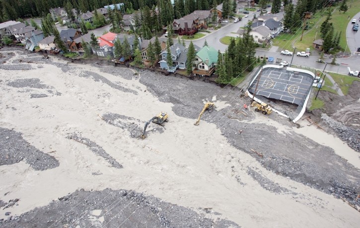 Long-term flood mitigation is proposed for Cougar Creek in Canmore after the 2013 debris flood damaged roads and homes.