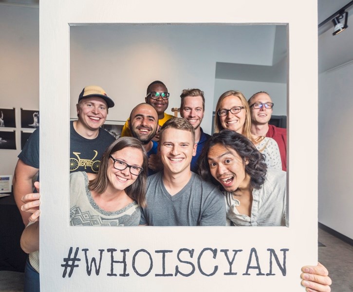 The board of the Canmore Young Adult Network holds up a CYAN photo frame during their What is CYAN night at artsPlace in Canmore on Tuesday (May 29). The group aims to
