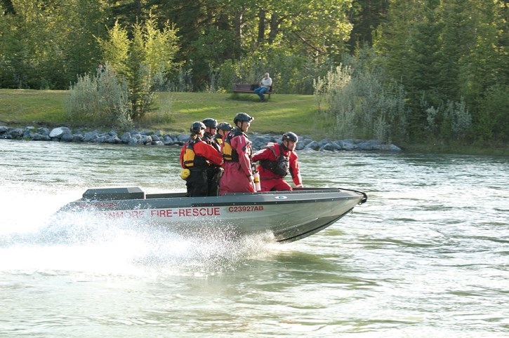 Canmore Fire-Rescue personnel respond to a situation where a female fell into the Bow River, Tuesday (June 5). The woman was transported from near Elk Island in Canmore to a