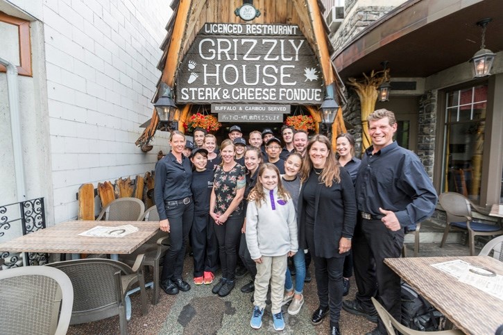 The staff of iconic food landmark the Grizzly House stand outside the Banff Avenue restaurant.