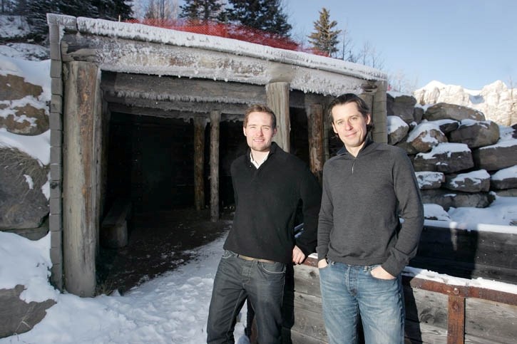 Haydn White, left, and Alexander Finbow of Renegade Arts Canmore at the entrance to their secret mountain lair.