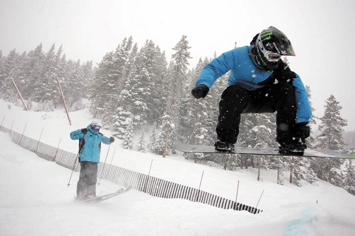 Ski and snocross track architect Johnny Balfour (right) and Evolve Ski and Snowboard club president Jim Sidorchuk (left) catch air off a step-up jump on the new ski and