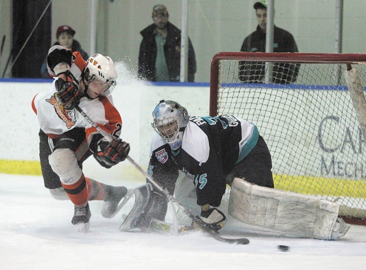Eagles goalie Steve Papciak makes one of ten consecutive shootout saves to guarantee the win over Drumheller at the Canmore Rec Centre Saturday night (Jan. 15).