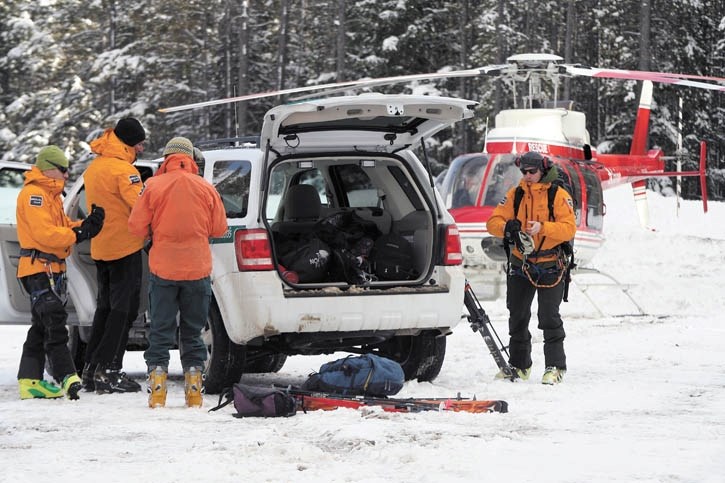 Parks Canada public safety staff prepare to search the debris field at the Norquay ski hill after an in-bounds avalanche occured Friday afternoon (March 11).