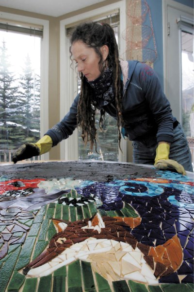 Banff artist Cindy Gibson at work.