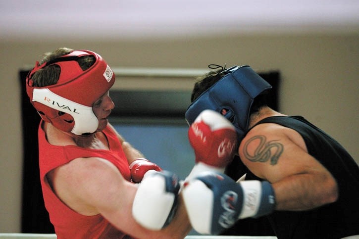 Craig Wilson from Canmore Fight Club fires an upper cut at Jeremy Kaliel during the Pieter Grobler Memorial Boxing Tournament at the Union Hall Friday night (May 13).