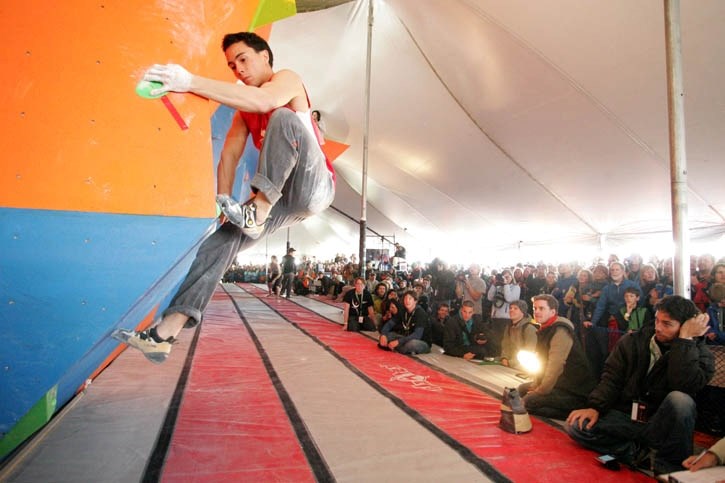 Canadian climber Sean McColl begins his ascent of a route during Saturday’s (May 28) bouldering World Cup competition.